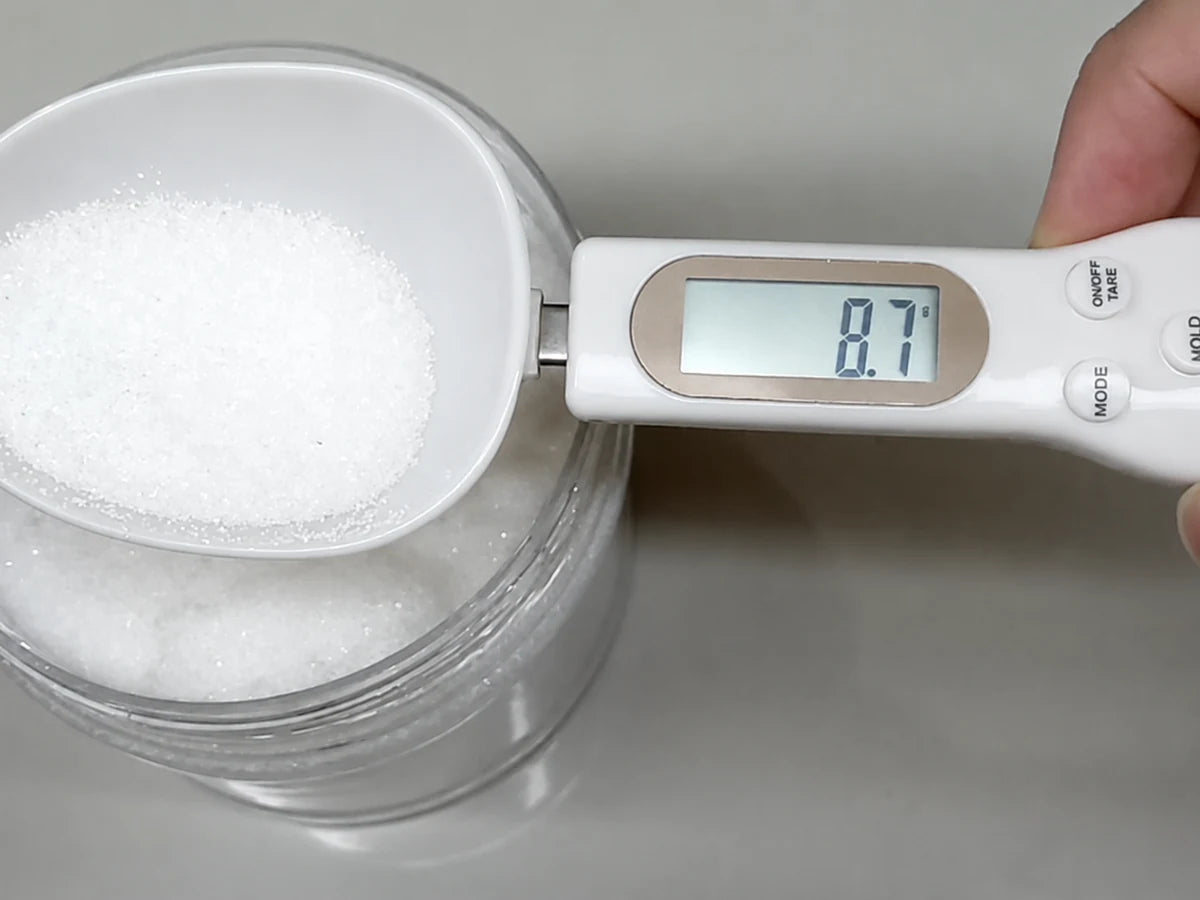 Measuring an ingredient with the spoon held level